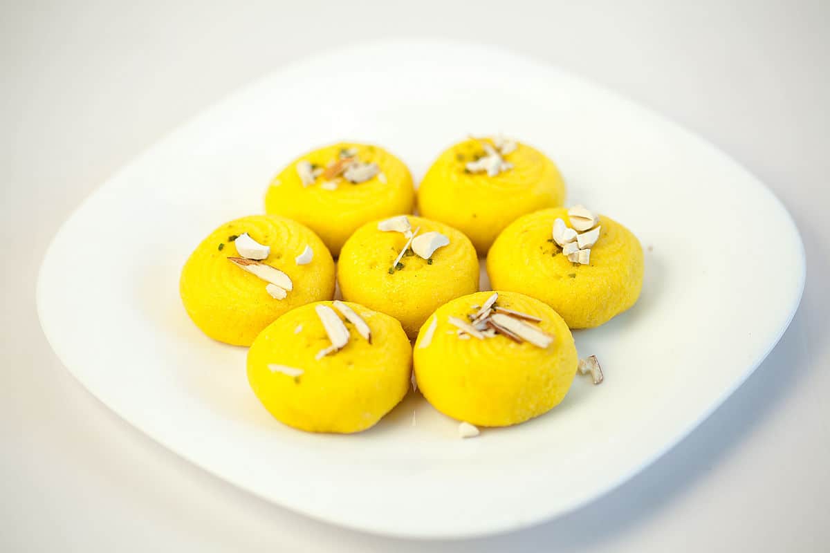TrendMantra 1200px-Indian_Sweet_Dessert_Peda_in_a_white_bone_china_plate 17 Mouth Watering Bihari Food Delicacies That Need To Be Tried At Least Once 